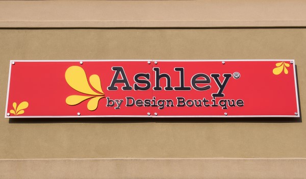 ashley by design boutique red sign july 19