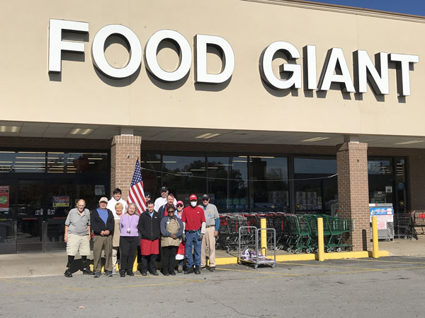 Knights of Columbus Leeds Council #5597 Flag Presentation Group Photo - Flag presented by Past Grand Knights, Dr. Bill Watkins and Terry Taylor, to Food Giant.