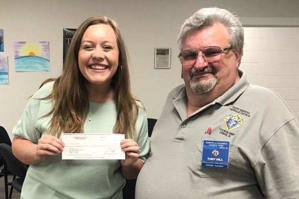 Leeds Knights of Columbus Leeds Council 5597 Donates to Local Schools - Grand Knight Tony Hill presented a donation to Jordyn Turner of Leeds